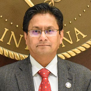 Mayor Henry Promotes Gunawardena to Director